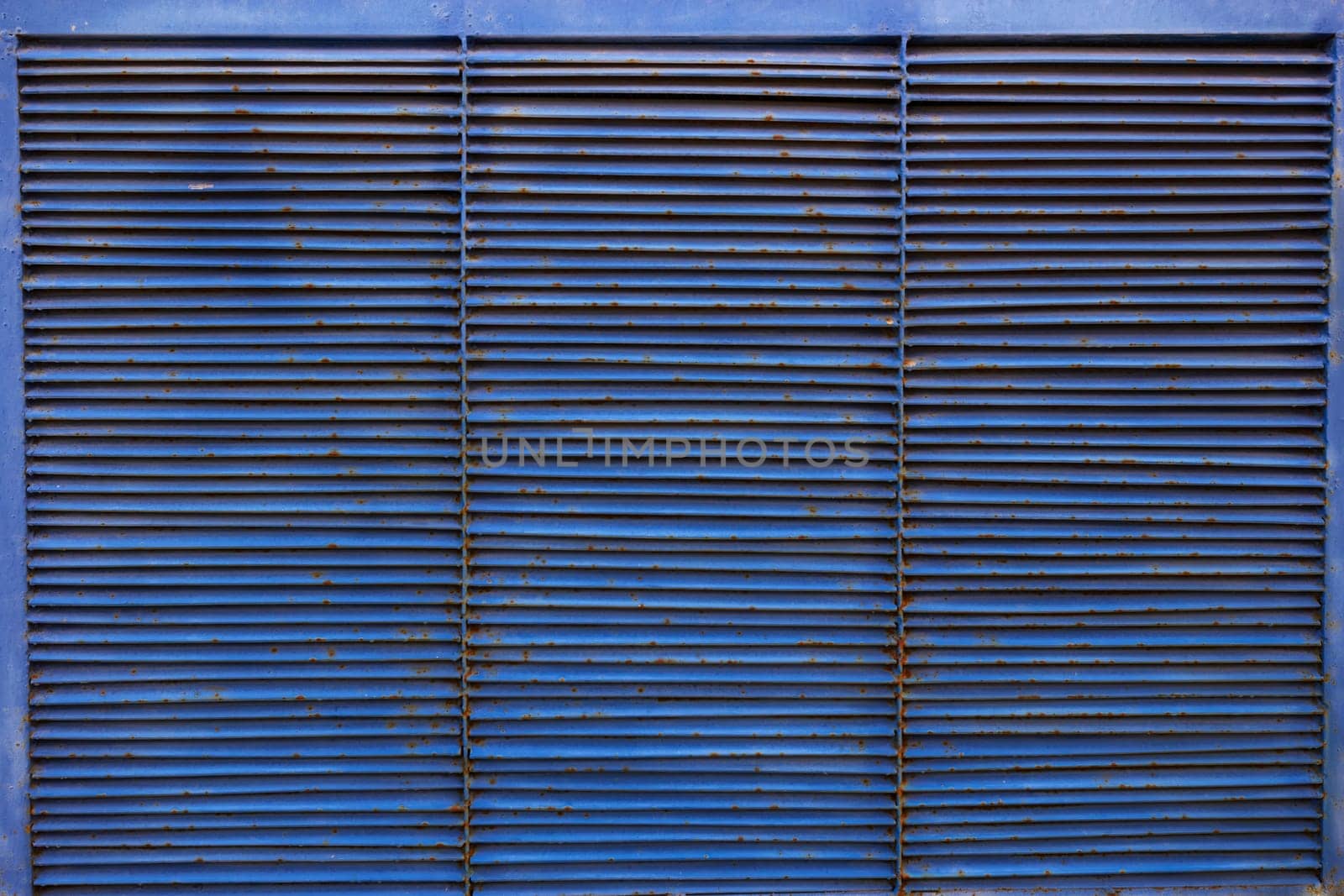Photograph abstract background blue metal grille blinds. horizontal stripes.