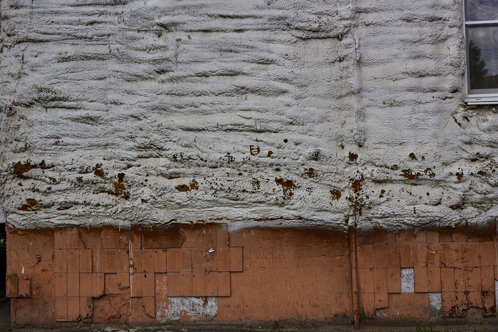 Photo of building polyurethane foam insulation of wall of house.