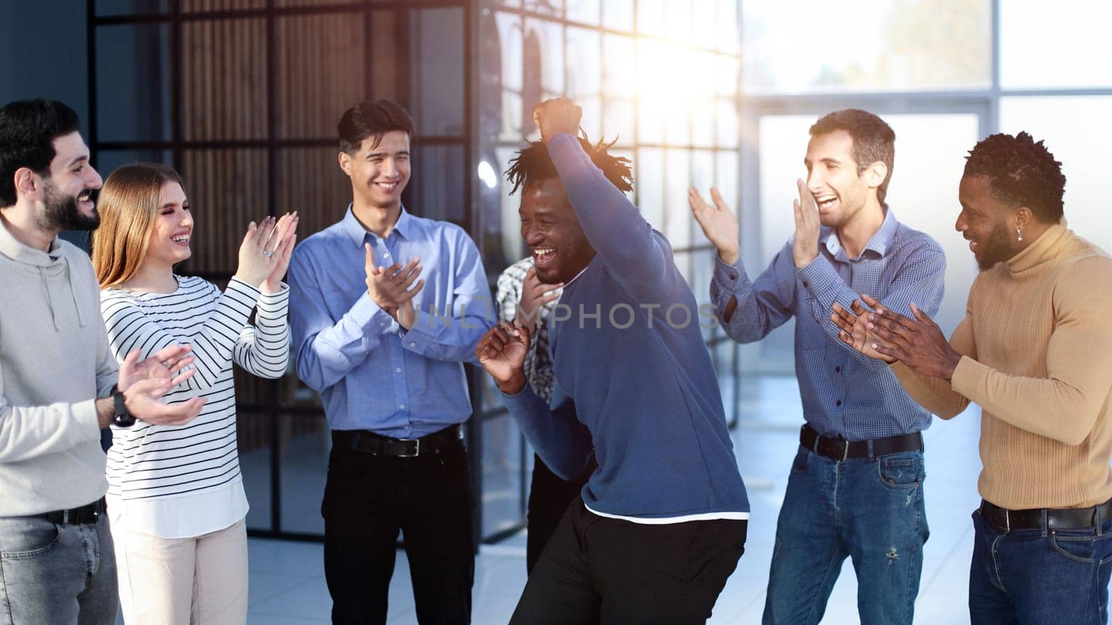 Business team of overjoyed professionals cheering, celebrating good sales result, financial goal achieving