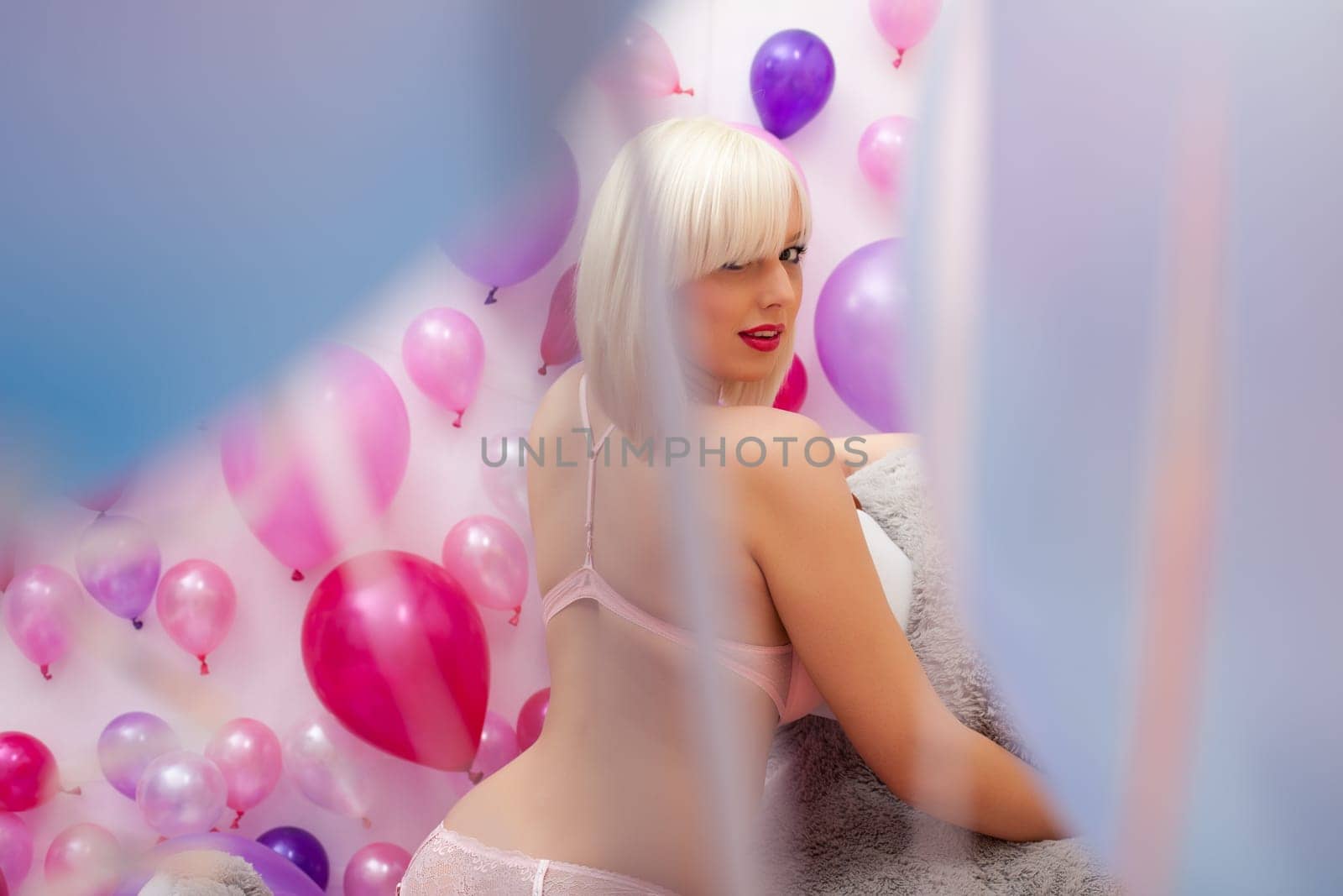 Image of pretty sexy blonde posing, turning at camera