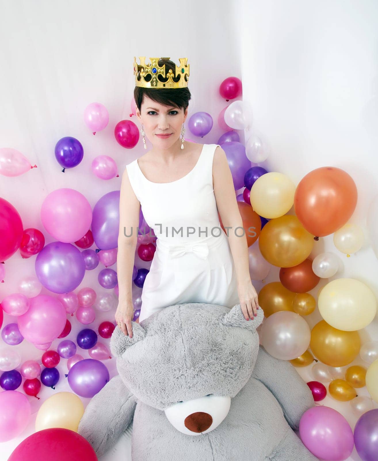 Image of elegant adult woman posing like little princess