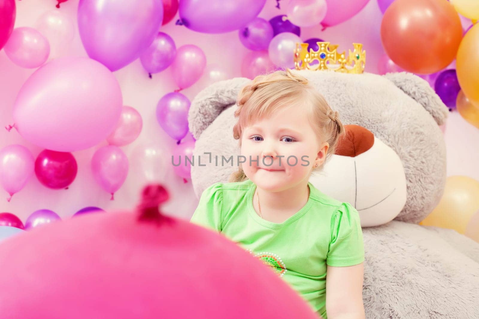 Image of amusing blonde girl posing in playroom