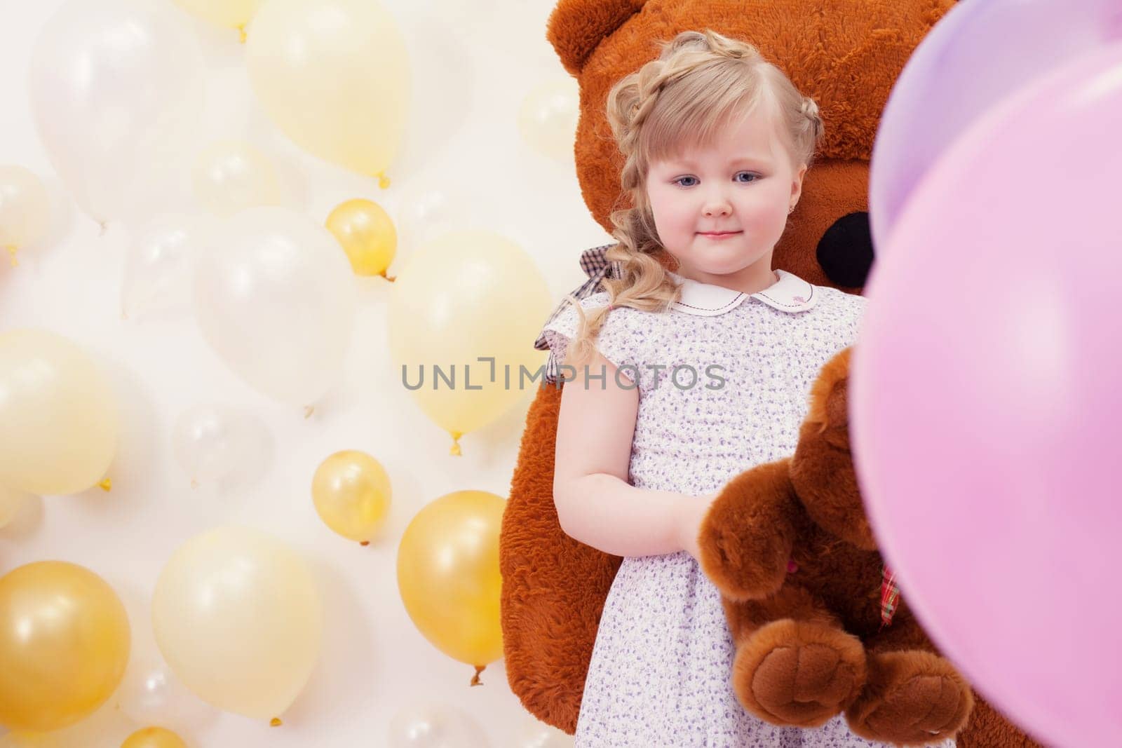 Image of pretty neat girl posing at camera in playroom