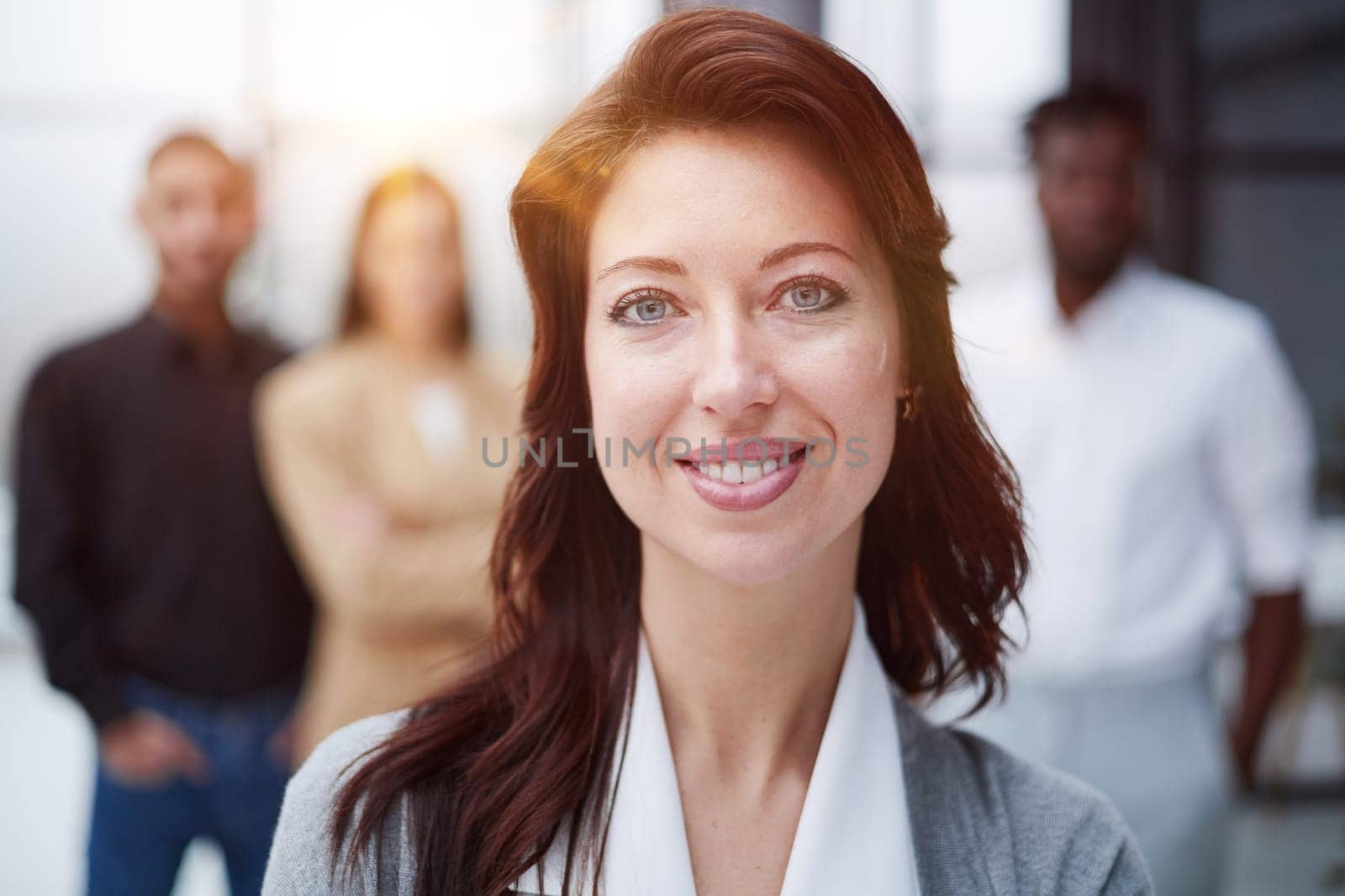 Portrait of a young business woman standing in the office