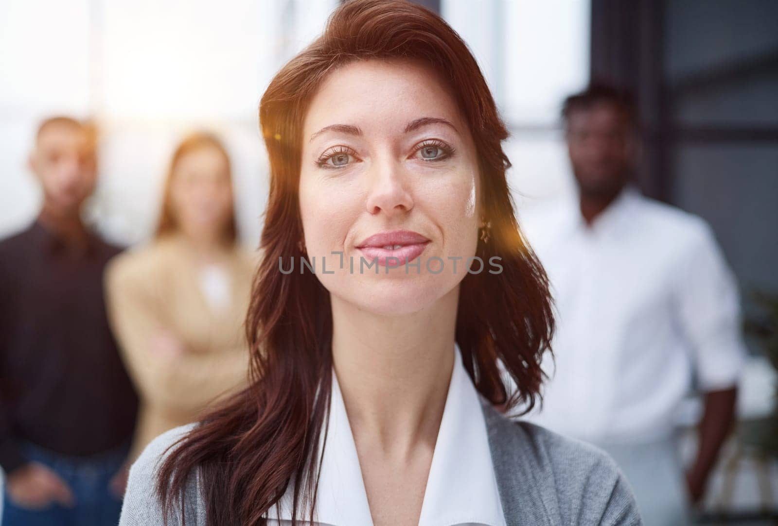 Portrait of a young business woman standing in the office
