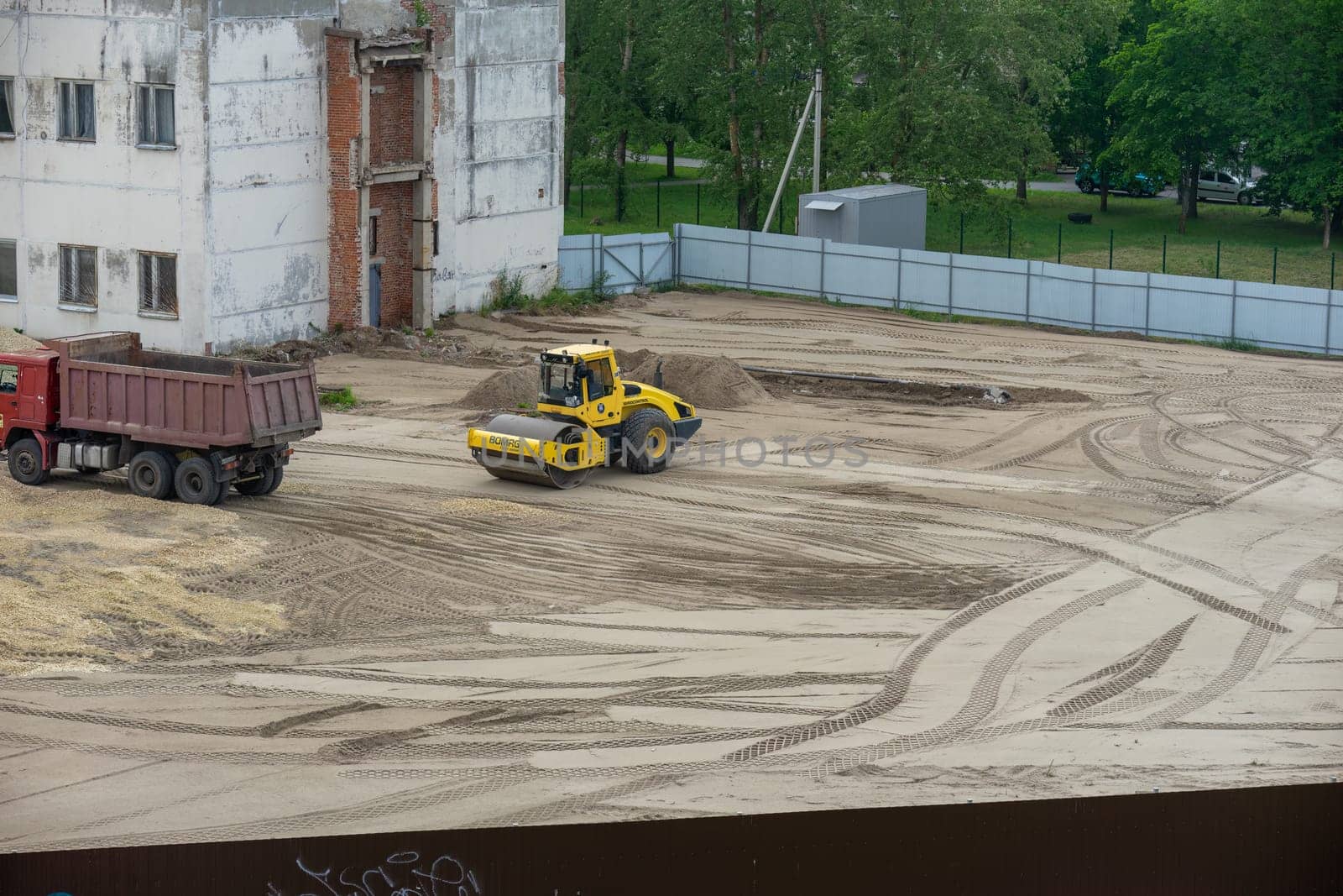 Works road machinery skating rink leveling the sand. High quality photo