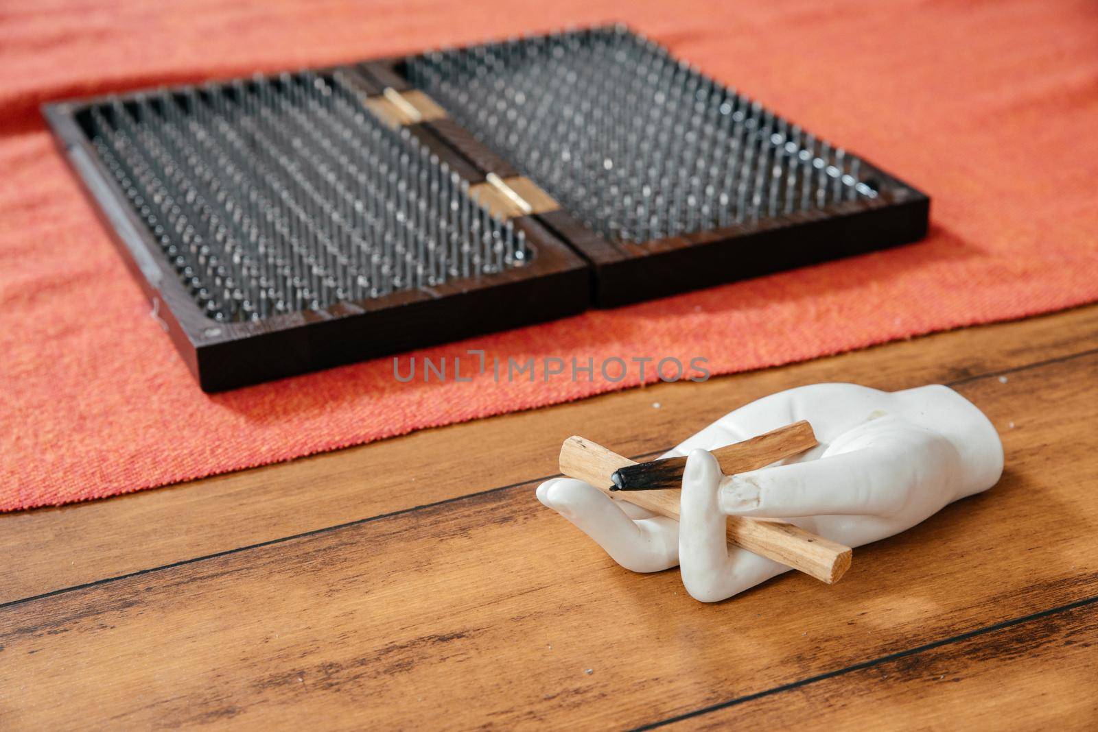 Sadhu board with sharp metal nails. Yoga and health concept by Mariakray