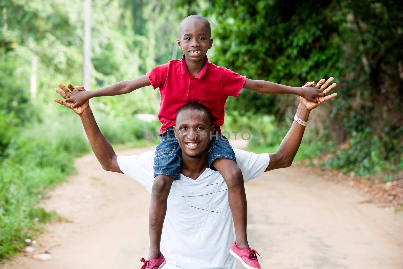 fathers Day. Father and child playing together outdoors on a road in nature