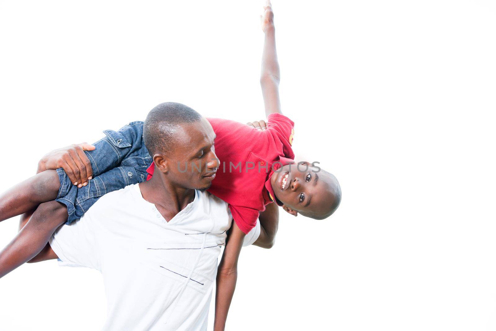 Portrait of father with his son having fun in the park. Family fun happy boy playing with dad outdoors in nature