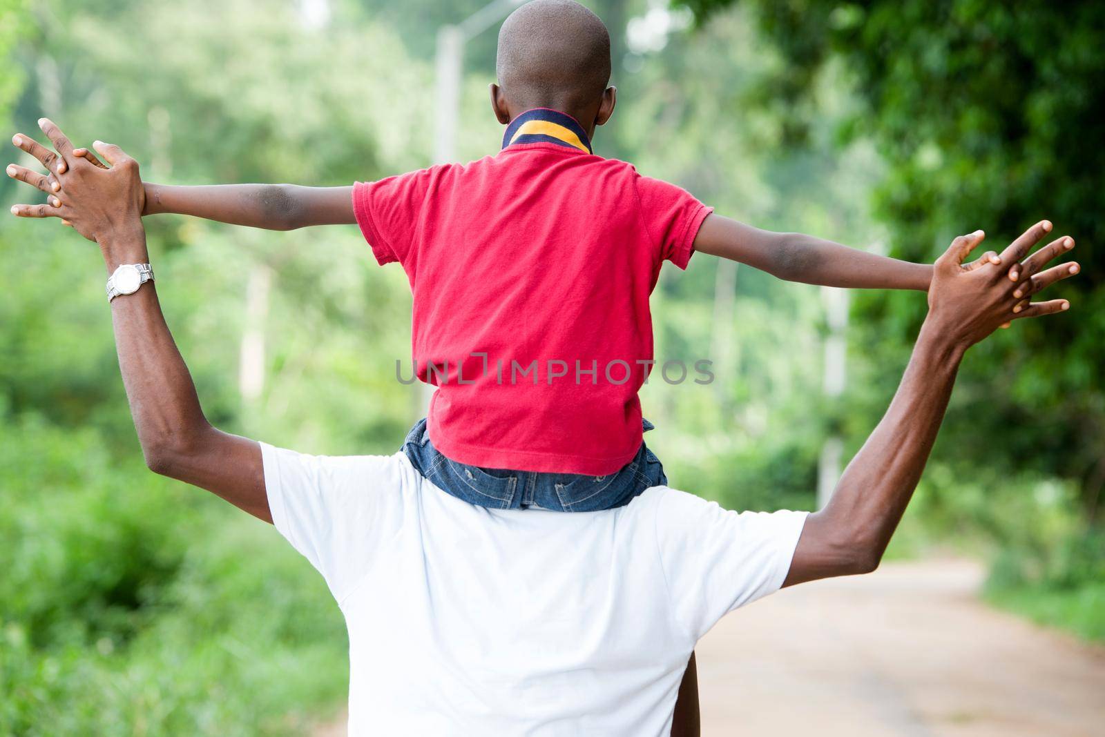 fathers Day. Father and child playing together outdoors on a road in nature
