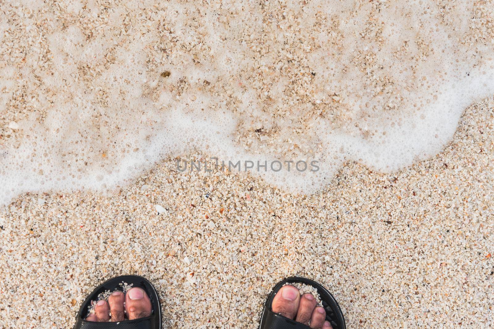 Soft wave of the sea on the sandy beach by Wmpix