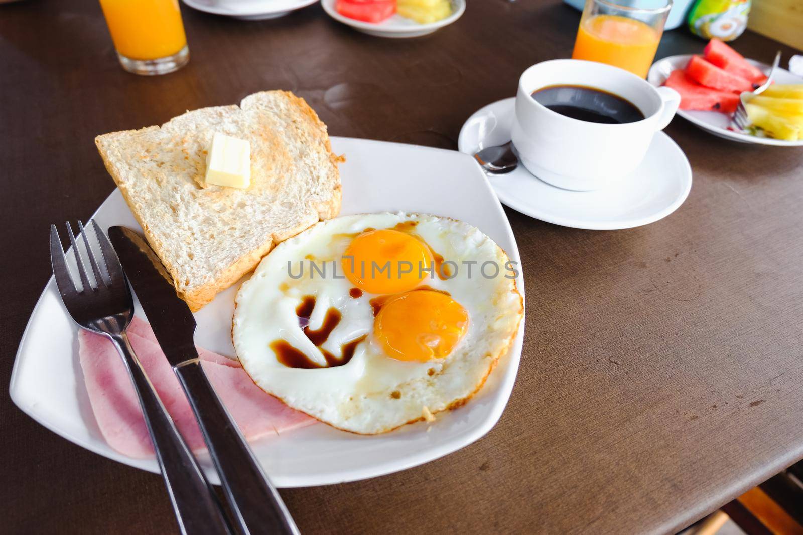 breakfast with coffee on wood table by Wmpix