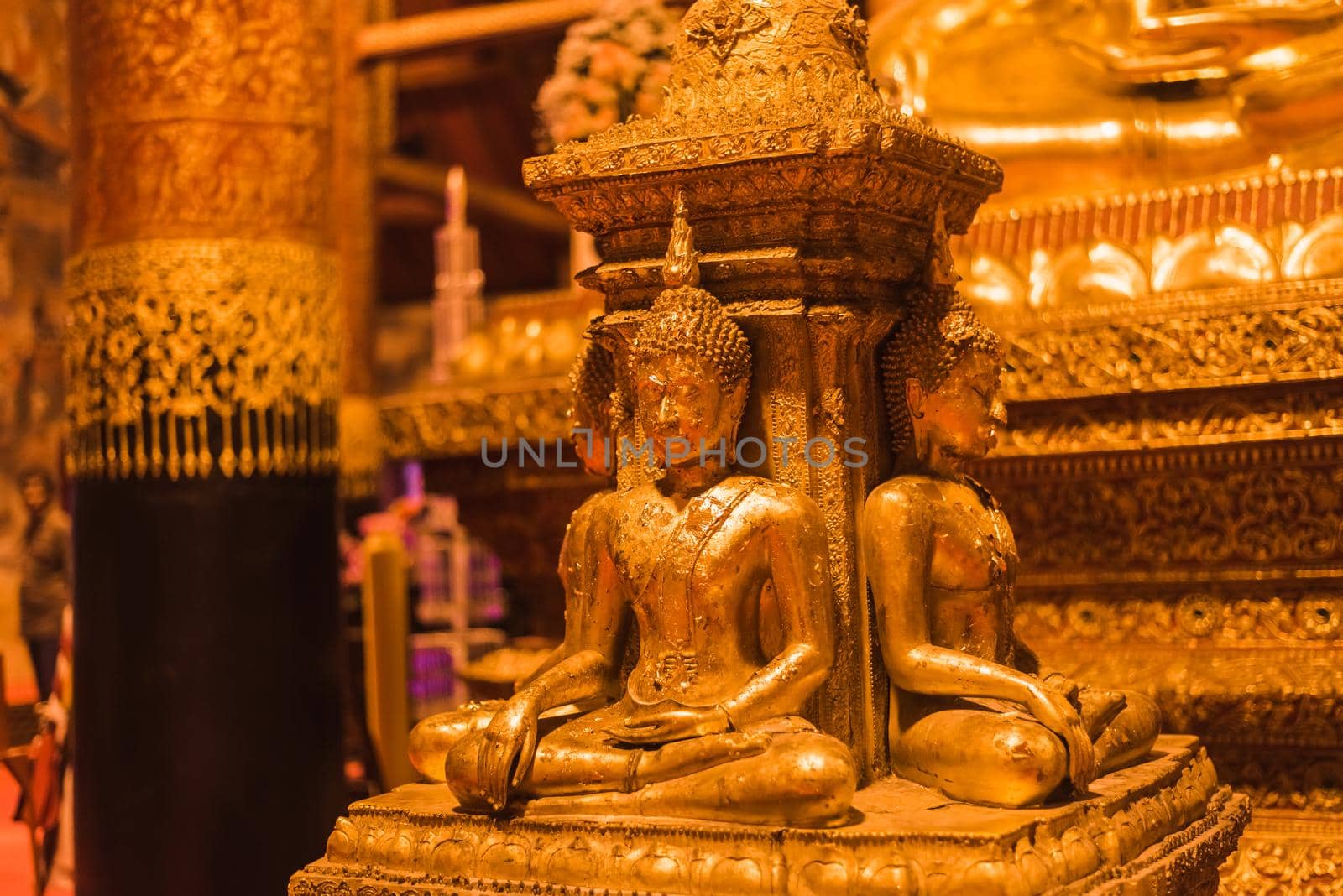 golden buddha image in Wat Phumin in Nan, Thailand