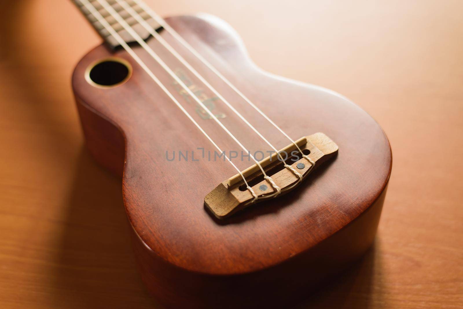 Vintage ukulele on wooden table
