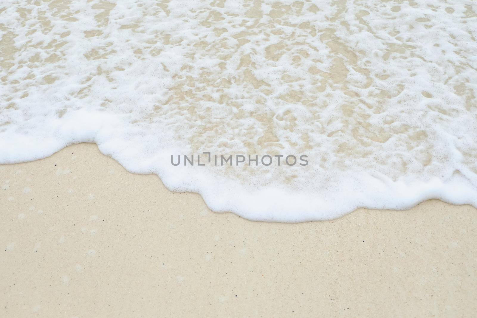 Soft wave of the sea on the sandy beach