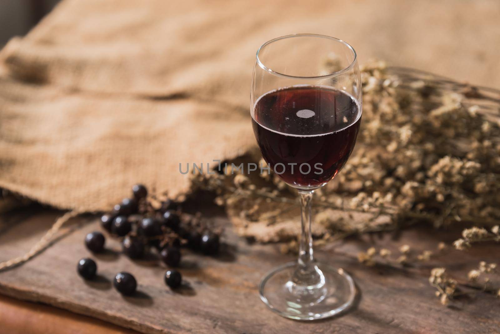 Glass of red wine and grapes