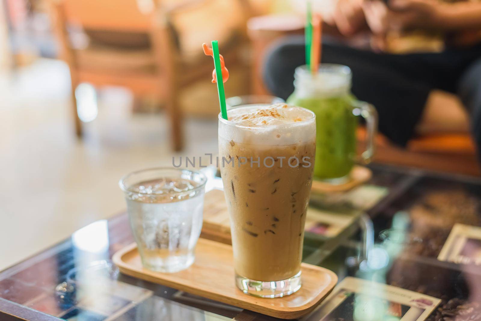 Ice cappuccino coffee on a wooden table