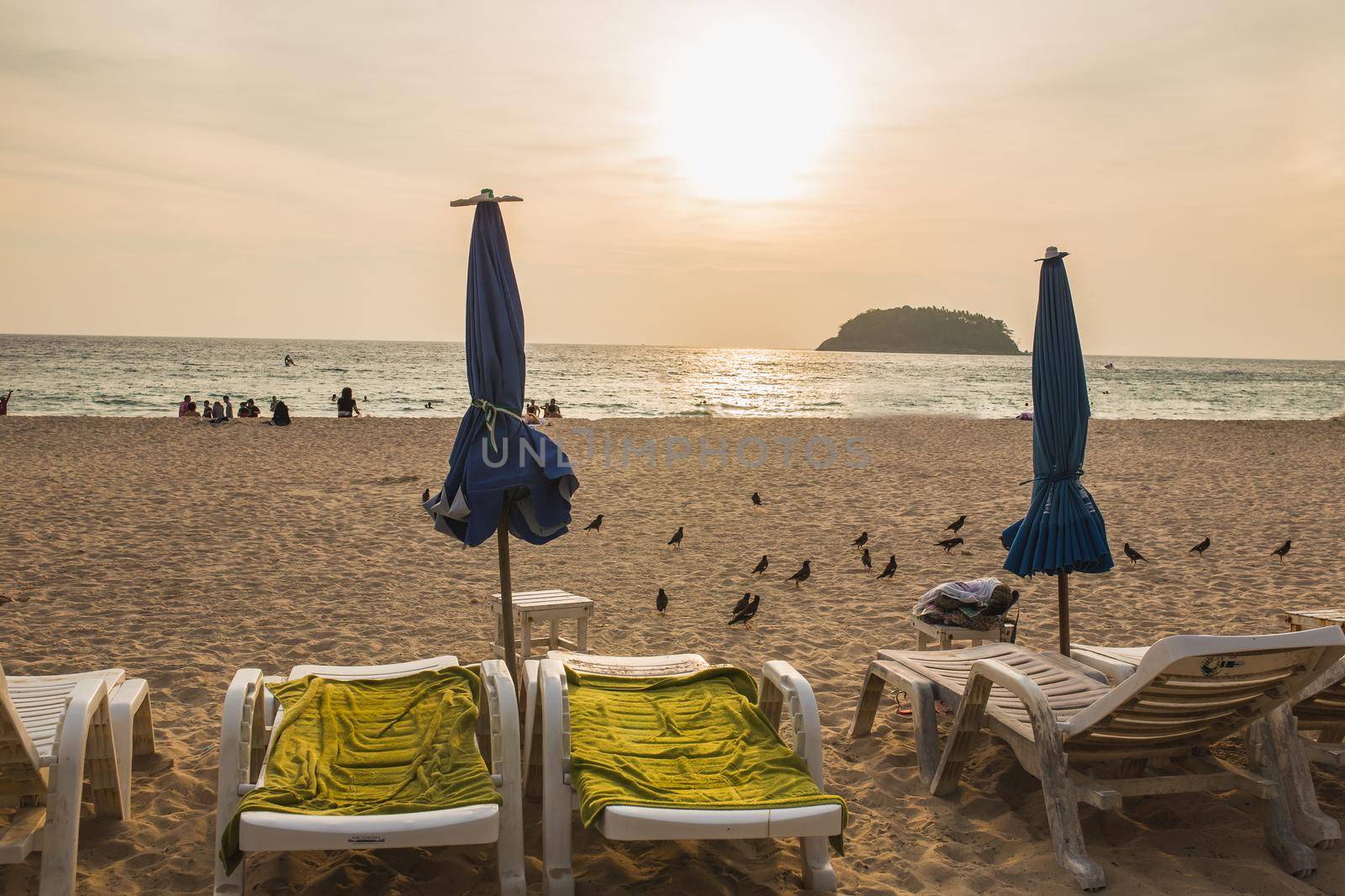 chairs on the beach sunset