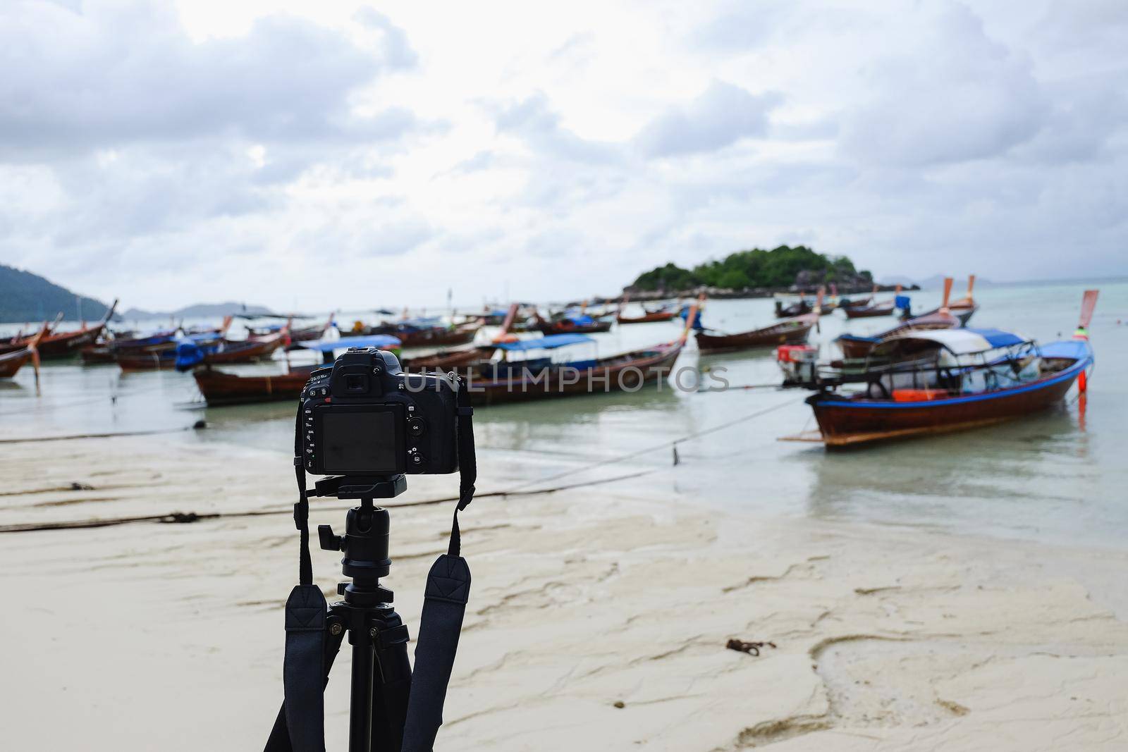 camera take photo fishing boat on the beach by Wmpix