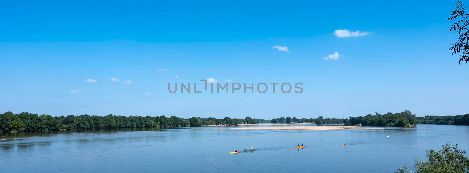 colorful canoes on river loire in france between tours and angers by ahavelaar