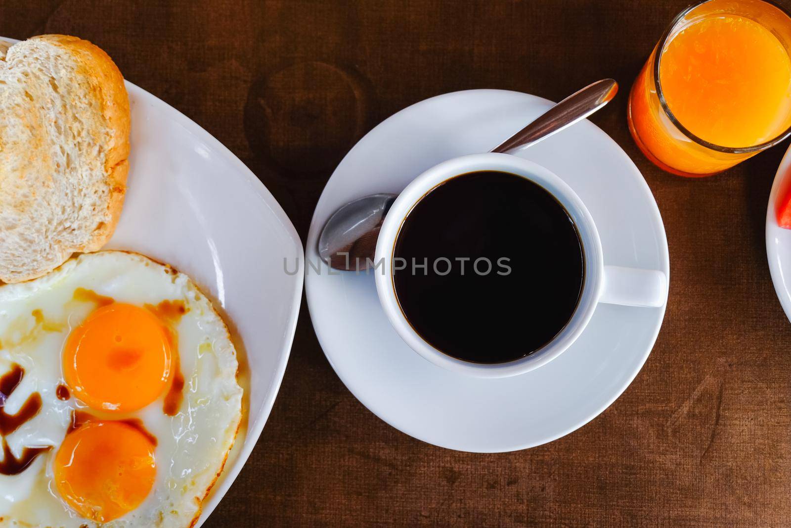 breakfast with coffee on wood table by Wmpix