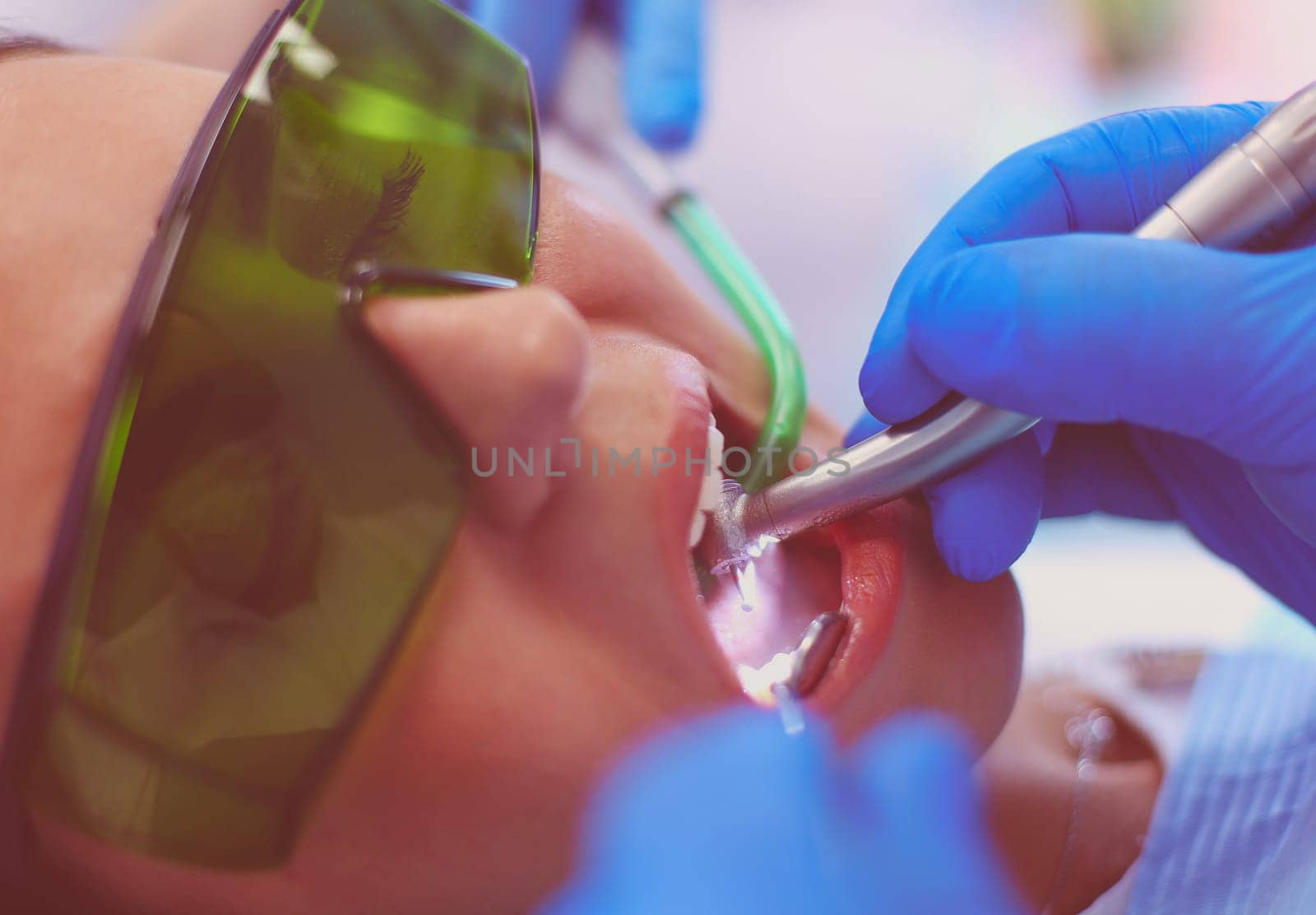 Dental team and patient at dentist's surgery.