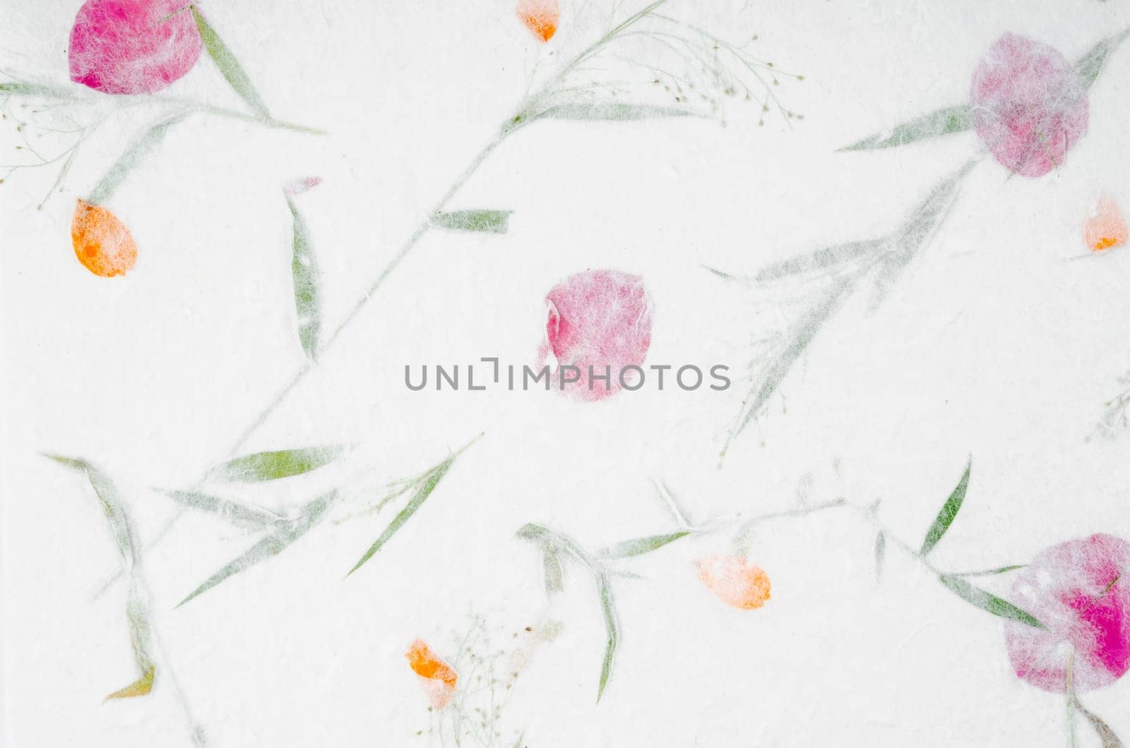 Handmade recycled flower and leaf paper or Mulberry paper texture as background.