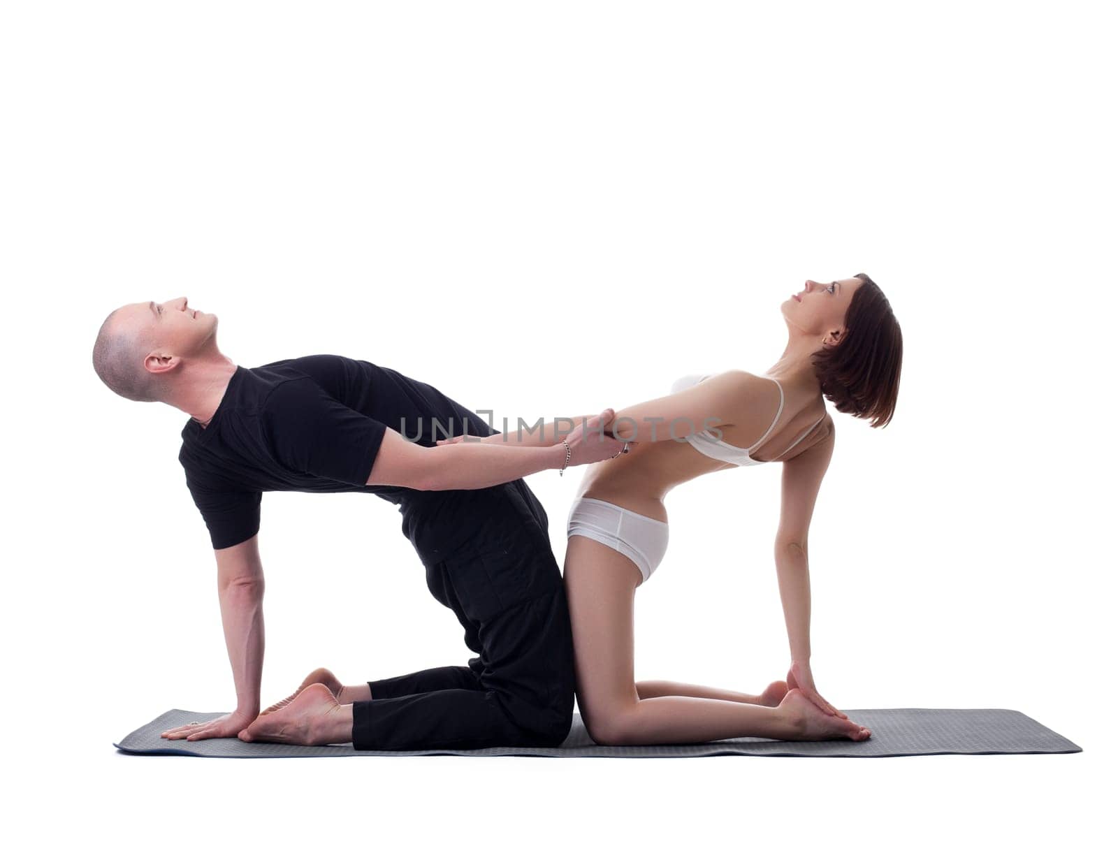 Couple of yoga instructors isolated on white by rivertime