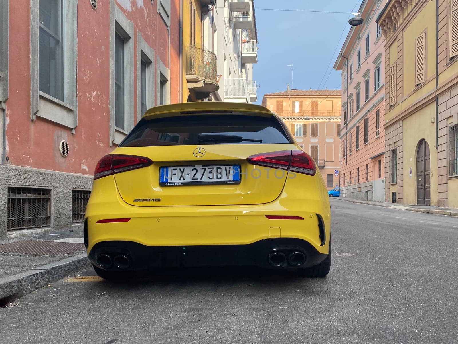 Cremona, Italy - April 2023 Mercedes Benz A class AMG yellow german compact design sport city car parked in the street