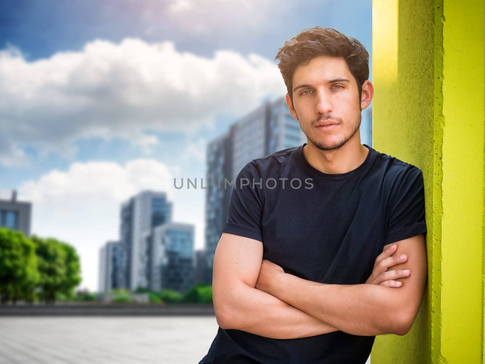 Head and shoulder shot of one handsome young man in urban setting by artofphoto