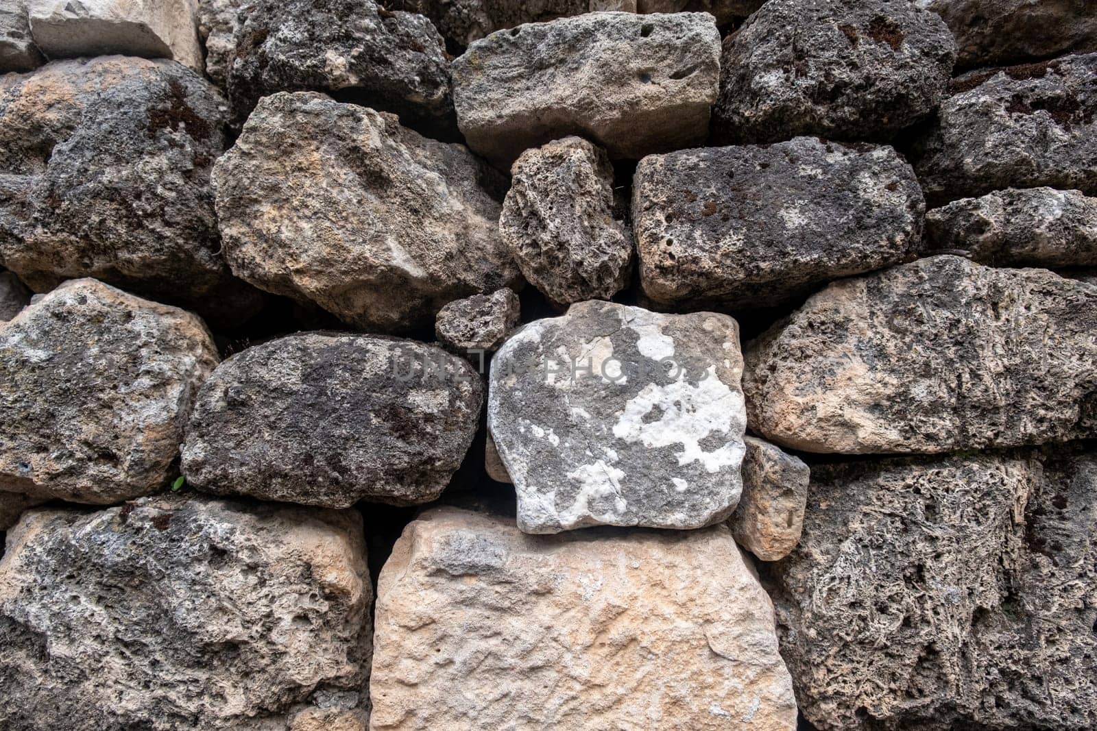 Texture of a stone wall. Old castle stone wall texture background. Stone wall as a background or texture. Part of a stone wall, for background or texture