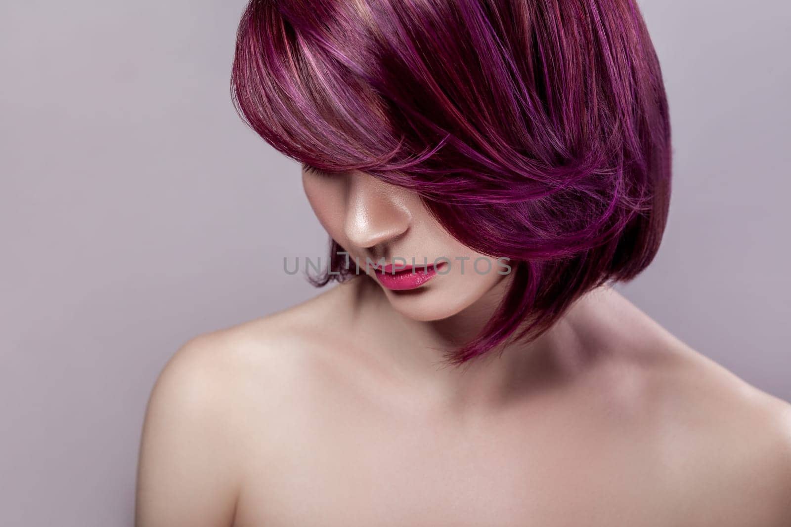 Calm beautiful woman with short purple colored hairstyle and pink lips, looking down. by Khosro1