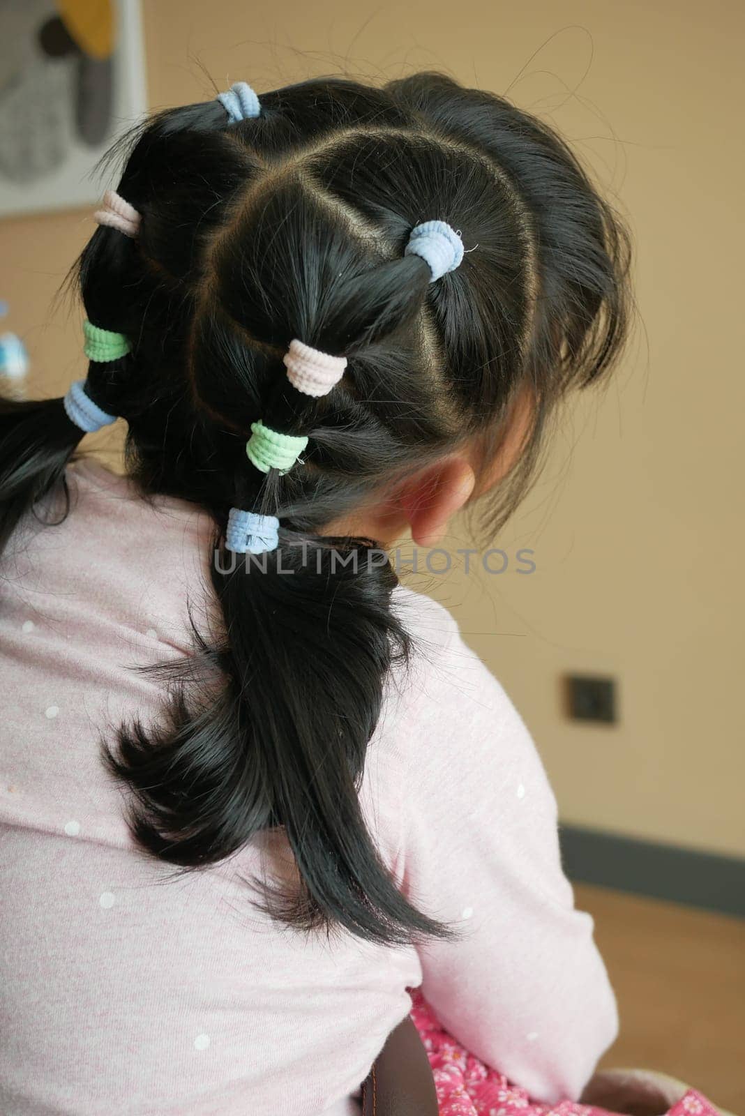 Beautiful ribbon is tied on a child hair by towfiq007