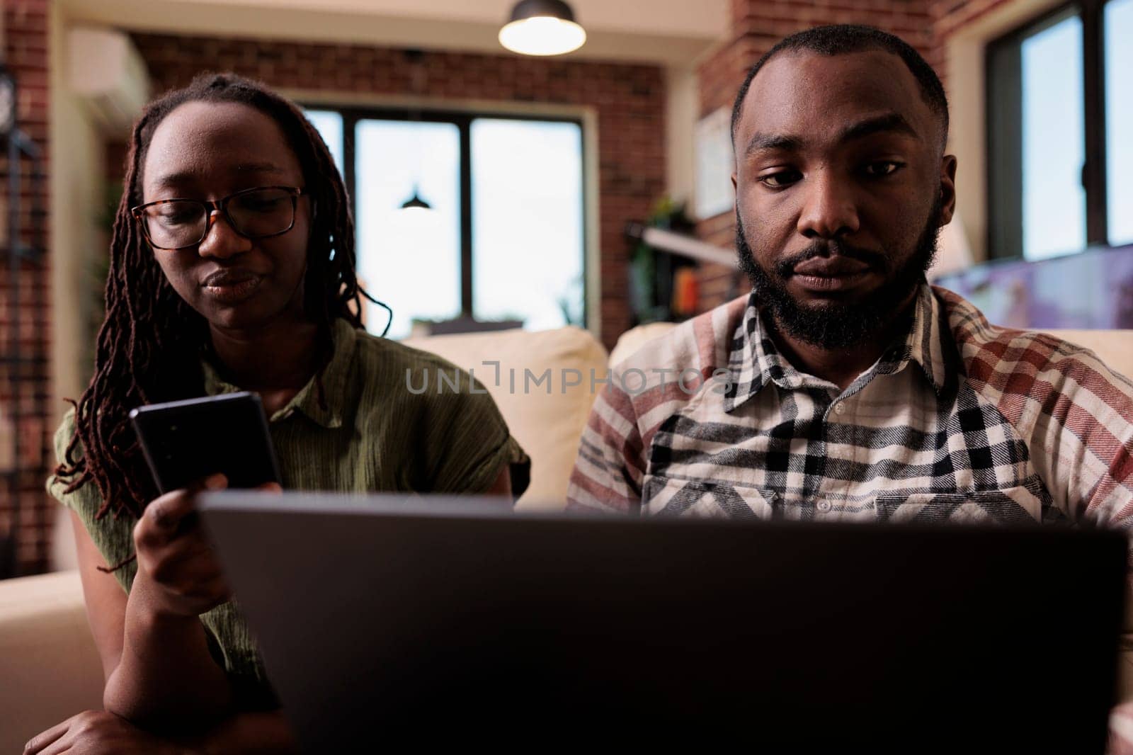 Couple having communication problems not talking to each other and using digital devices by DCStudio