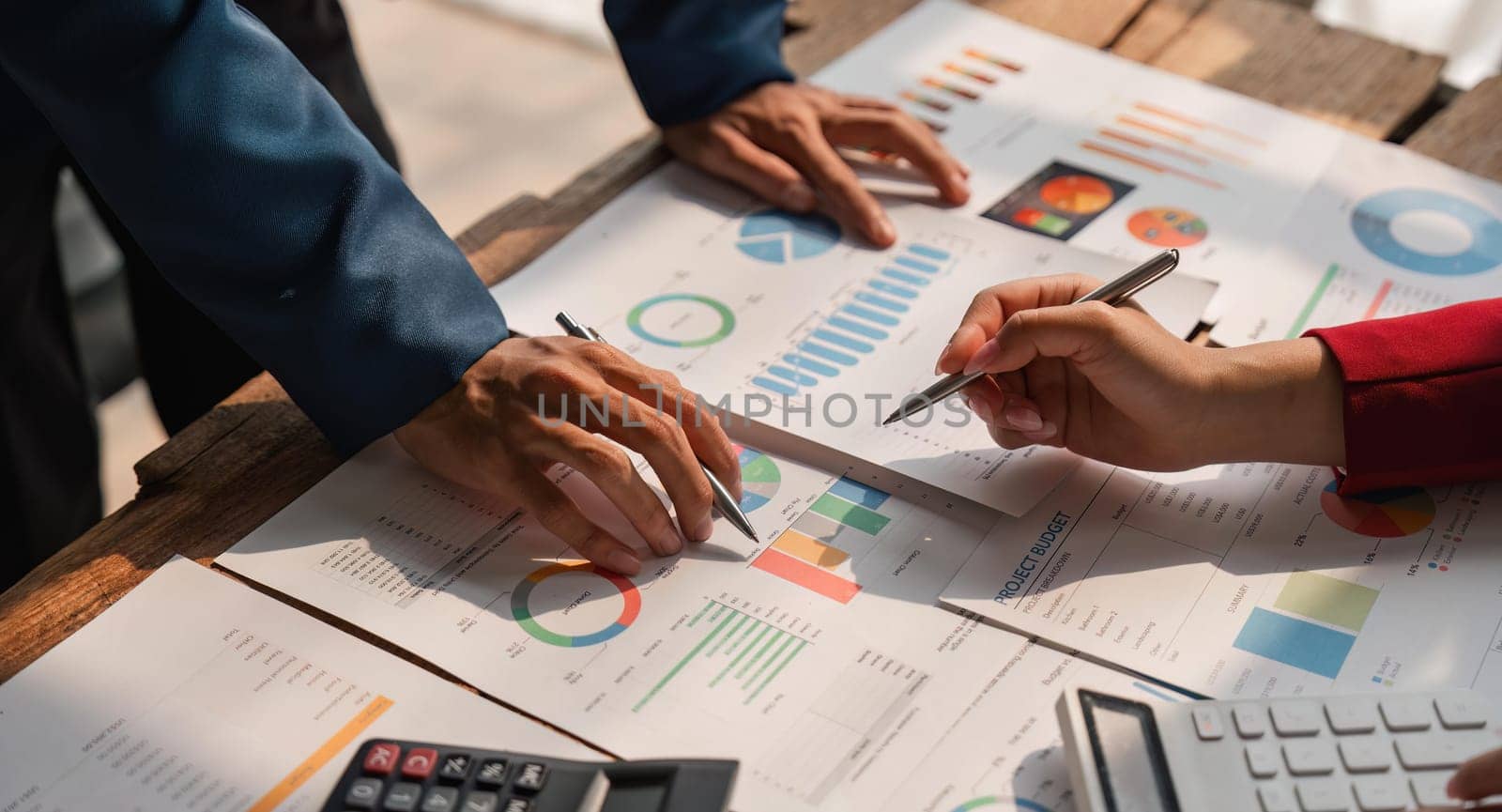 Business team analyzes financial business finance reports on laptop and graph documents during corporate meeting discussions showing successful teamwork, business meeting ideas.