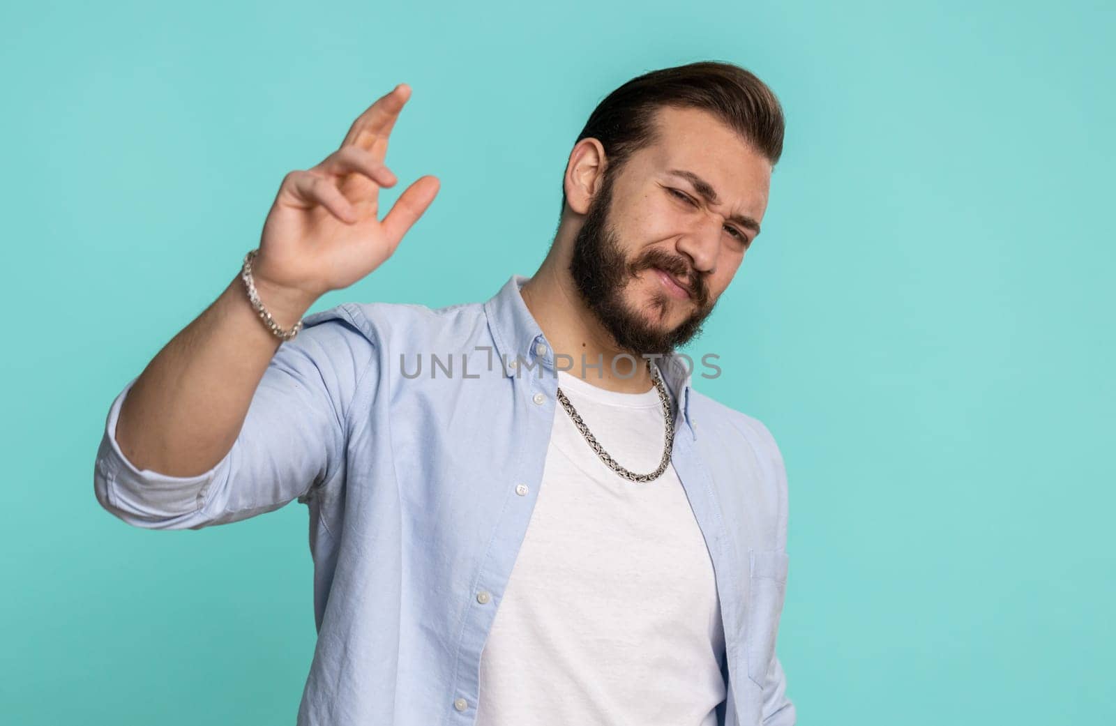 Bearded lebanese man, feeling hopelessness, loneliness, nervous breakdown, loses becoming surprised by lottery results, bad fortune, loss, unlucky news. Arabian middle eastern guy on blue background