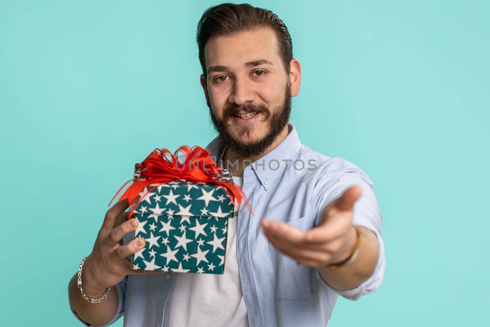 Lebanese man presenting birthday gift box, offer wrapped present career bonus celebrating party sale by efuror