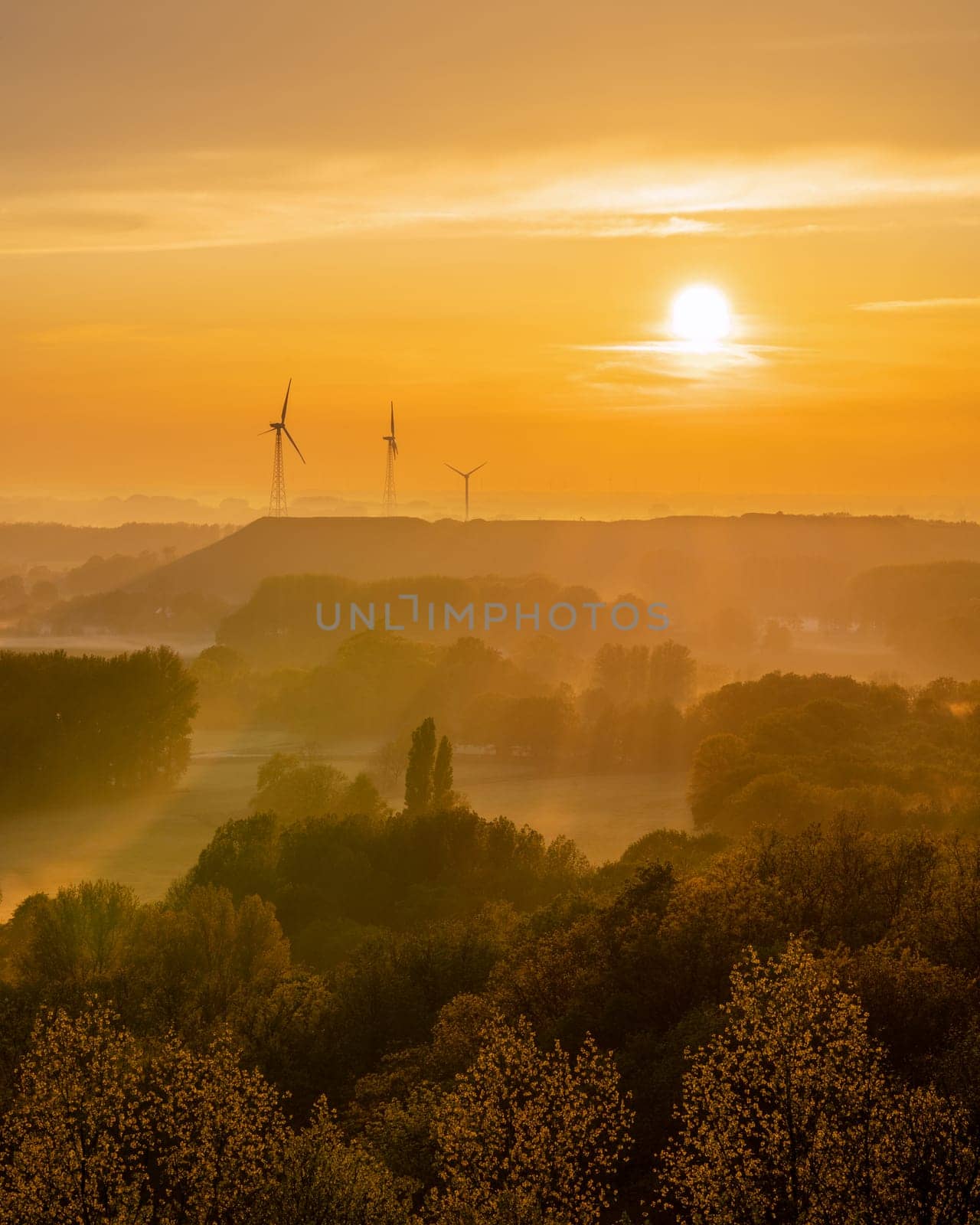 Evening mood, hills of Lower Rhine during sunset with evening fog, North Rhine Westphalia, Germany