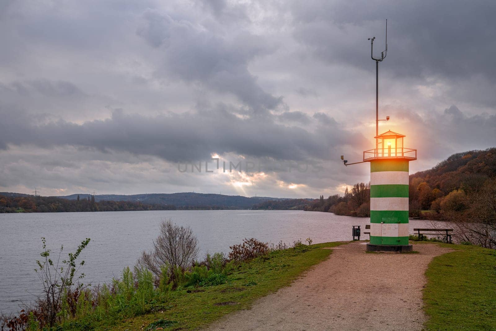 Panoramic image of the lighthouse at the lakeside of Kemnader lake, North Rhine Westphalia, Germany 