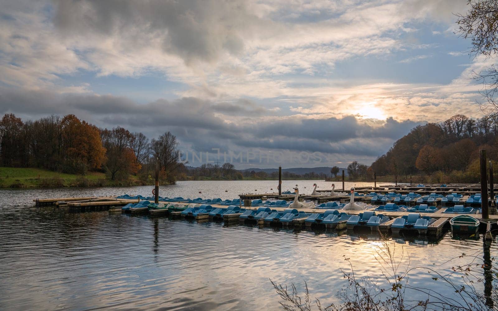 Panoramic image of paddleboats, autumn at the Kemnader lake, North Rhine Westphalia, Germany