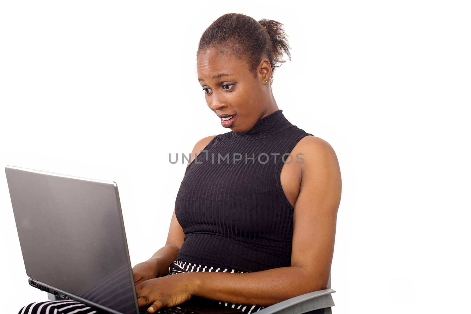 Attractive beautiful businesswoman having success in business. Charming beautiful woman holding a laptop and looking for some business information.