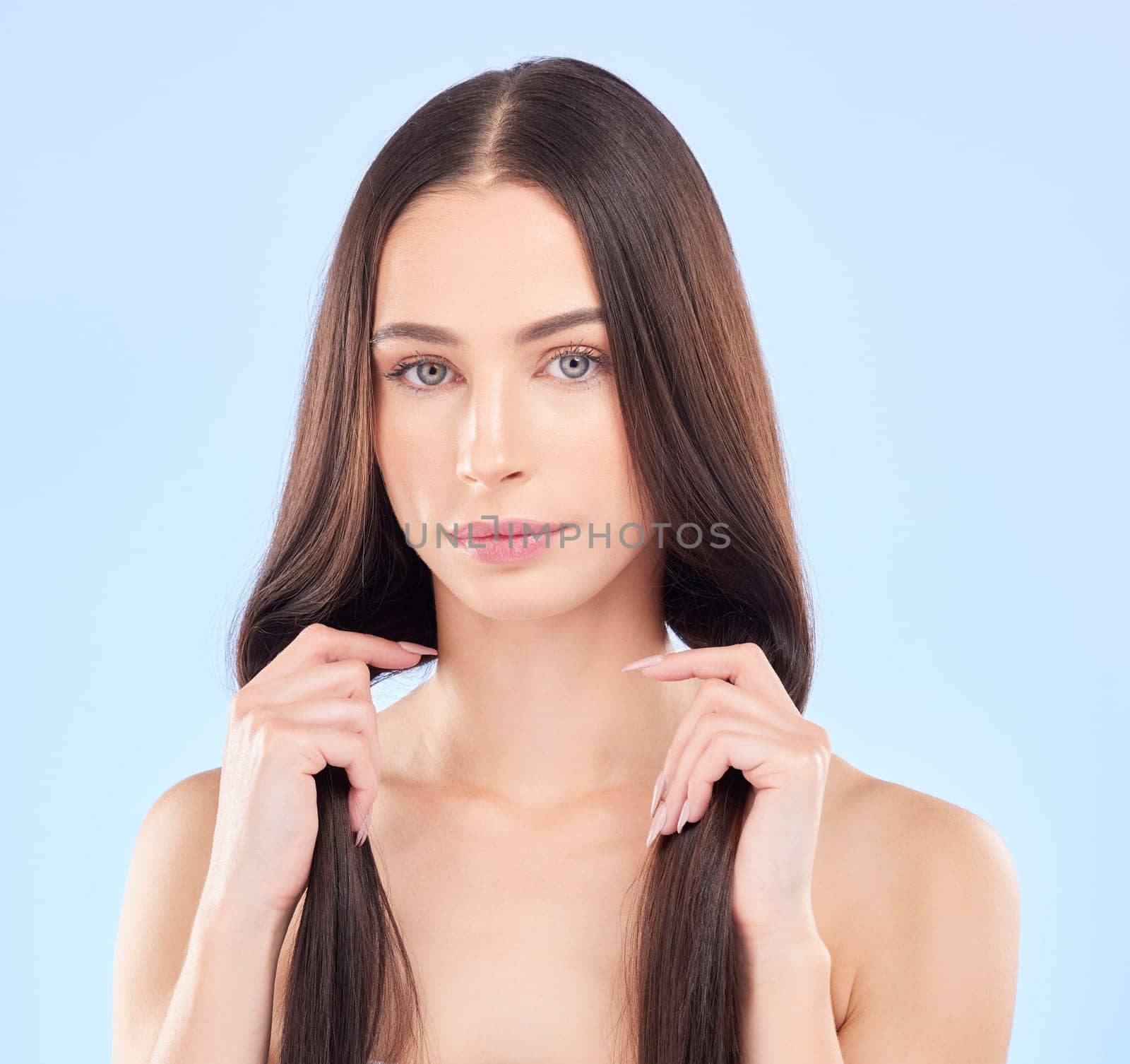 Hair, portrait and beauty, woman and cosmetic care with keratin treatment and texture on blue background. Female model face, haircare and salon hairstyle, Brazilian shine and growth in a studio.