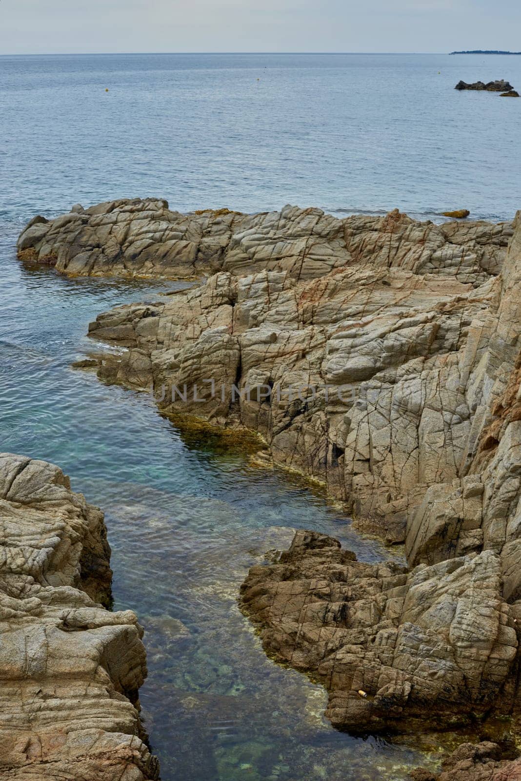 Rocks in the water. Top view dark blue sea water wave in the sea. Top-down form aerial view.