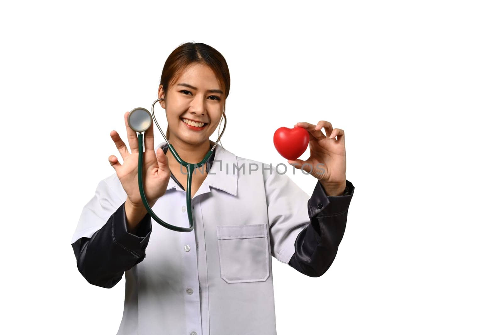 Image of female doctor holding stethoscope and red heart isolated white background. Cardiology, medicine and healthcare concept.