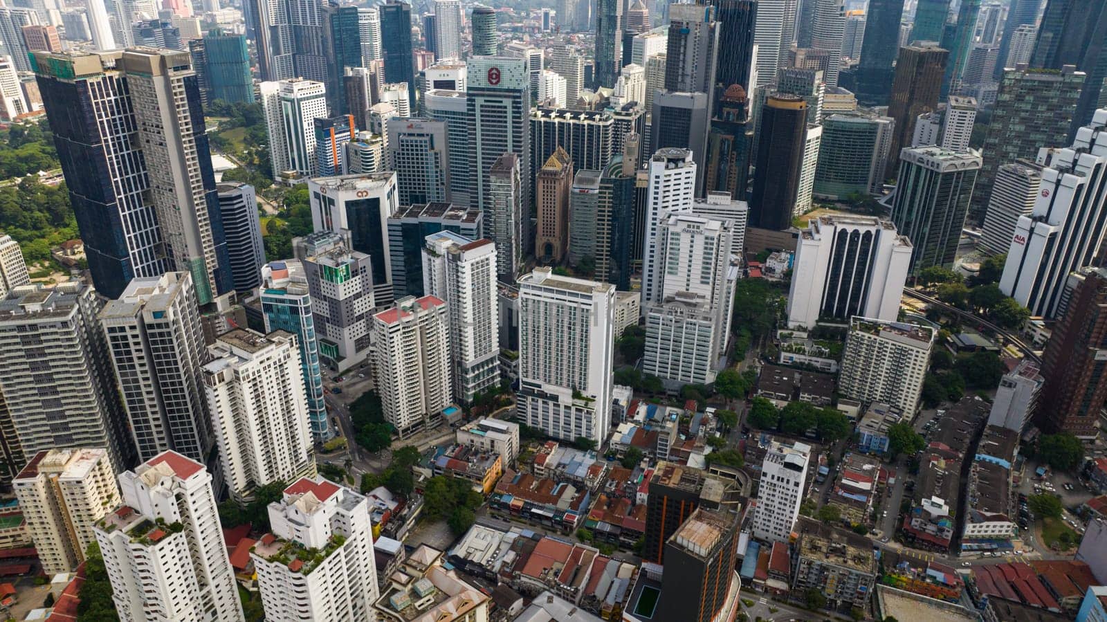 Kuala Lumpur, Malaysia - September 11, 2022: Aerial view of streets and skyscrapers in Kuala Lumpur city.
