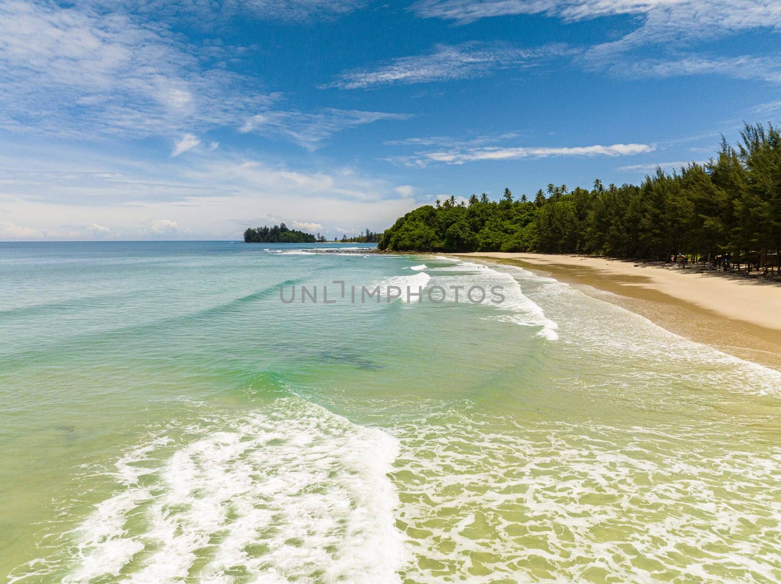 Sandy beach and turquoise water in the tropics. Sabah, Borneo, Malaysia.