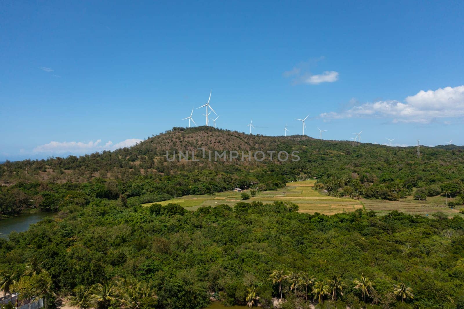 Aerial drone of Wind turbines producing clean sustainable energy, clean energy future. Wind power plant. Philippines.