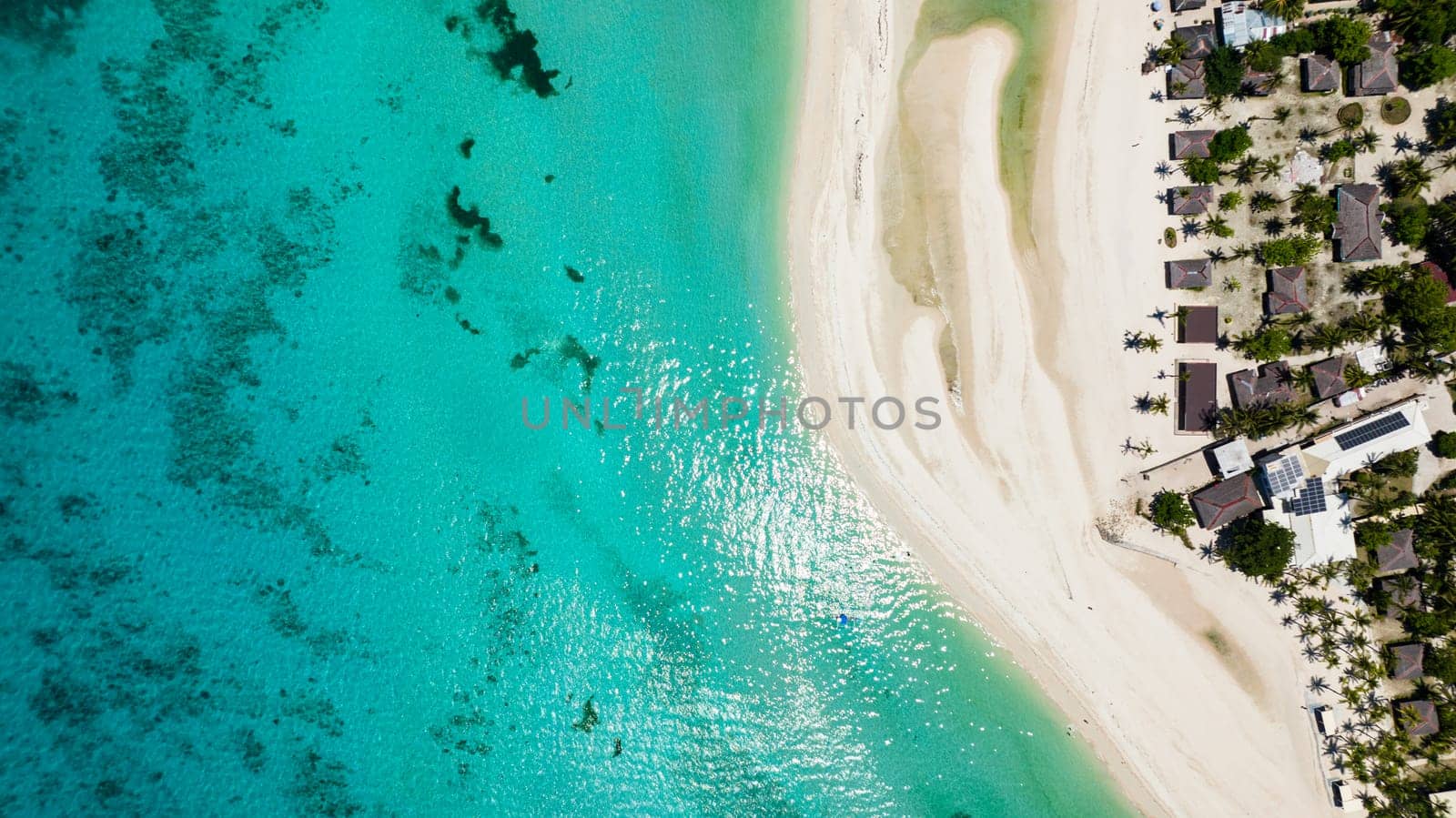 Aerial view of tropical beach and clear turquoise water in the tropics. Bantayan island, Philippines.