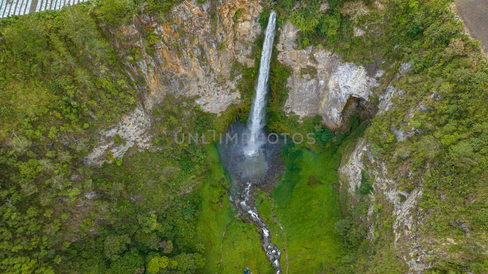 Waterfall in the tropical mountain. Sipiso Piso Falls in a mountain gorge. Sumatra, Indonesia.