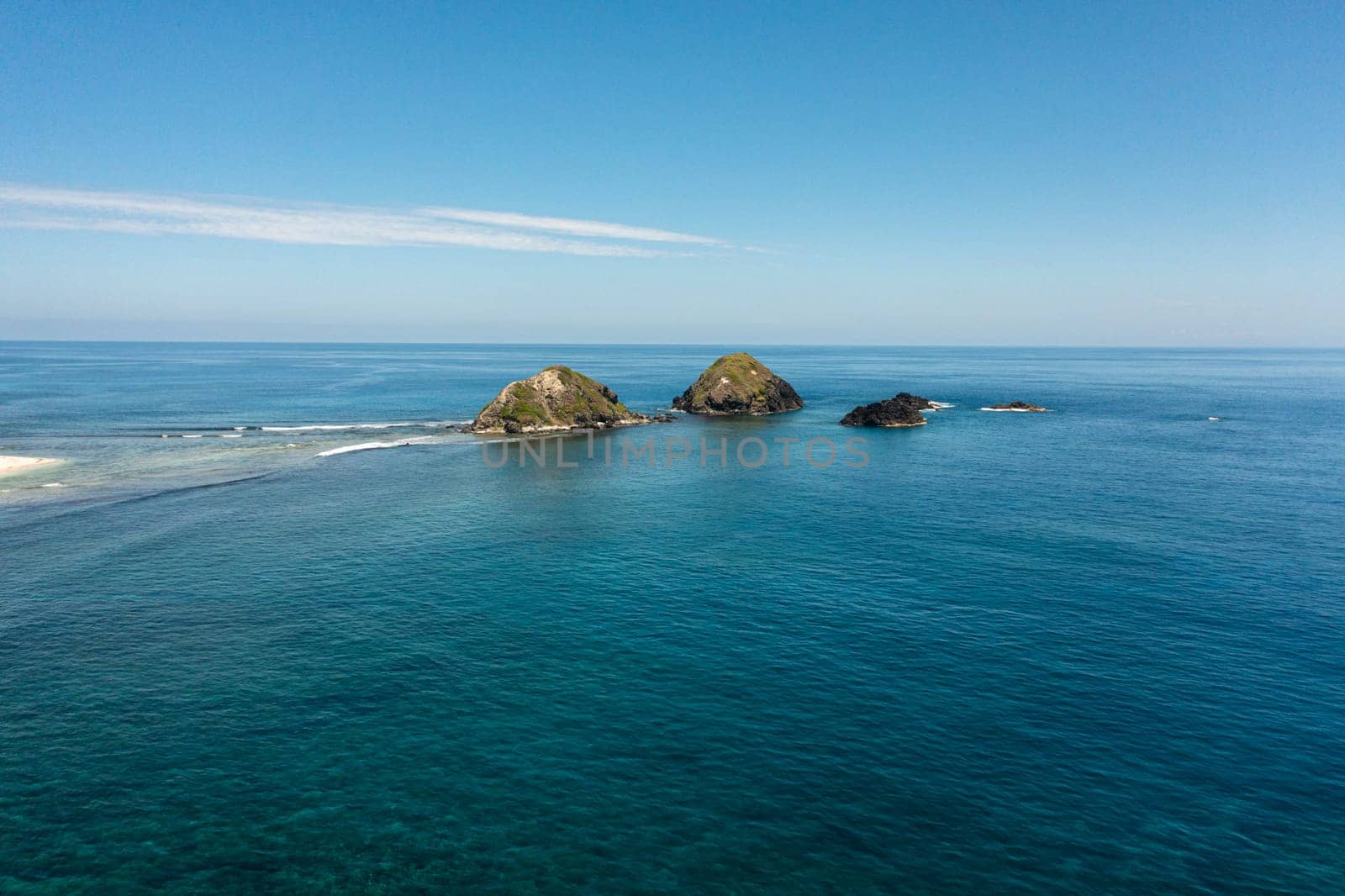 Rocky islands and blue ocean. Seascape in the Philippines.